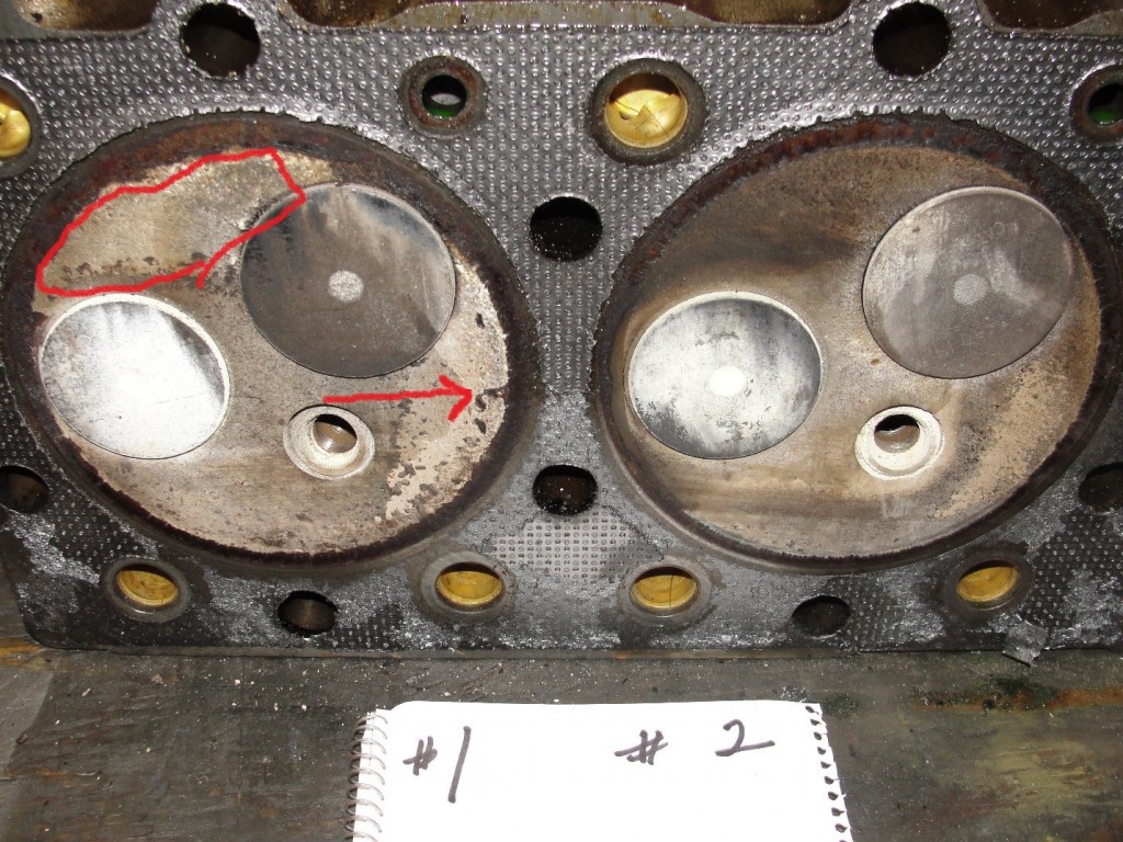 deposit build-up on cylinder head and exhaust/intake valve faces.